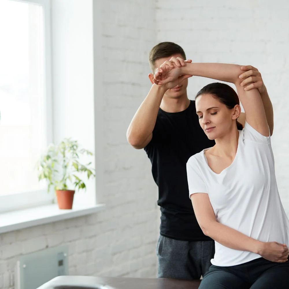 Revitalize_Physical_Therapy_About_Page_Arms_Exercise_With_The_Help_Of_Physiotherpist